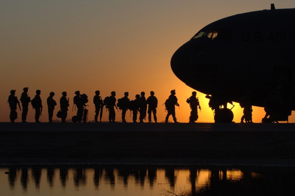 US soldiers in line to get in a plane