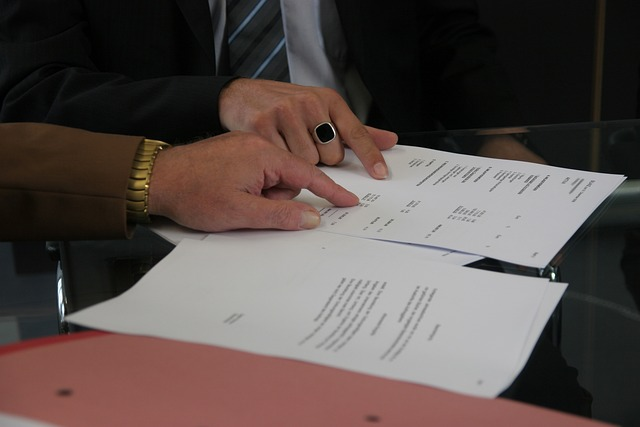 Two person reading a military lease agreement