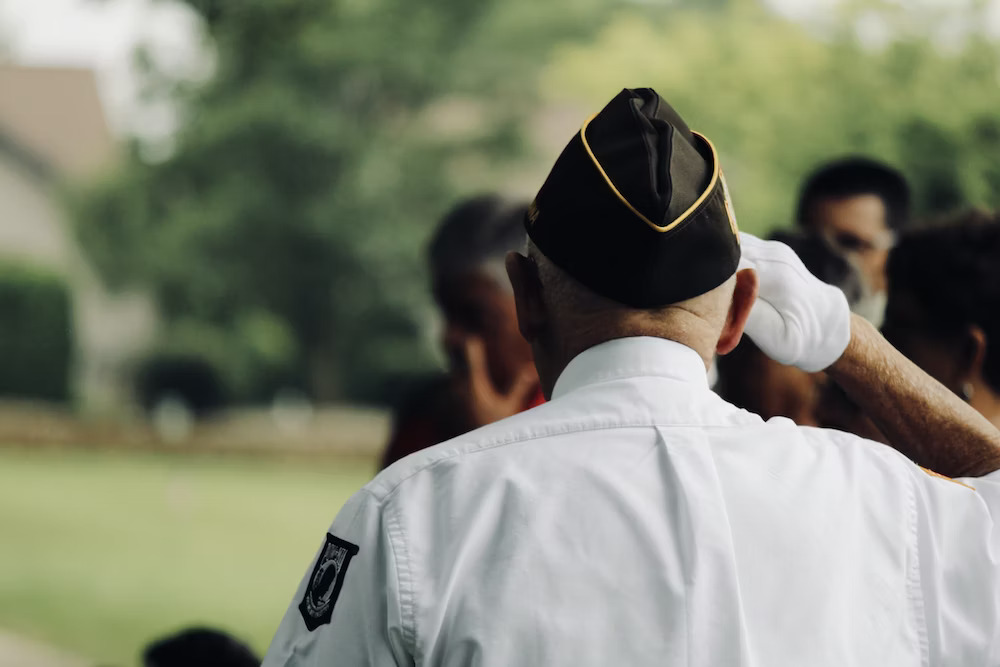 man-wearing-white-uniform-saluting - DMDC Military Verification