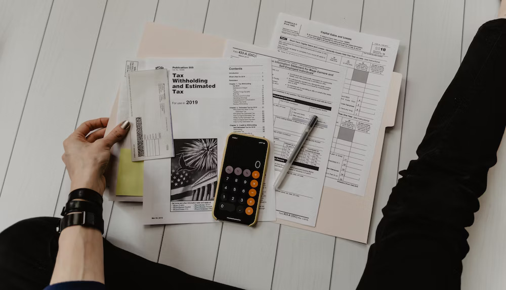 A person sitting with tax documents